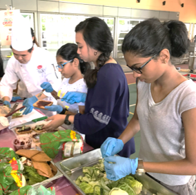 Partner imparting culinary skills to youths